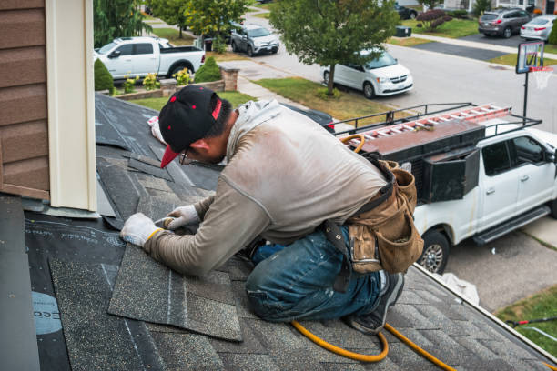 Professional Roofing technician working in Amherst, MA